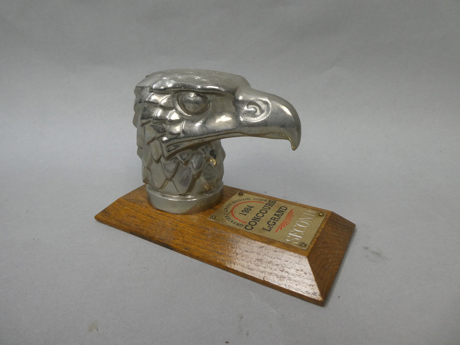 Rene Lalique Brass Eagle Head Hood Ornament Trophy: Rene Lalique Brass Eagle Head Hood Ornament Trophy. Nickel plated. Made from a mold from an original Lalique crystal hood ornament. Measurements in inches: 4 1/2 high Condition:Good with no problems S