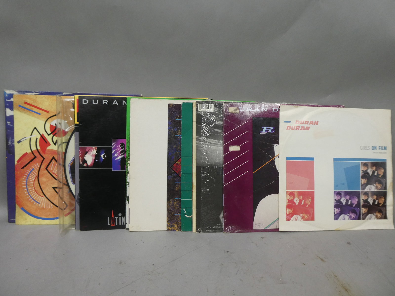Lot 13 Duran Duran Assorted LP Record Vinyl Albums: Lot 13 Duran Duran Assorted LP Record Vinyl Albums including Arena, 7, Reflex, Presidential Suite, Burning the Ground, Latin Rascals Mix, New Moon on Monday, Self Titled, Notorious, Union of the Snake