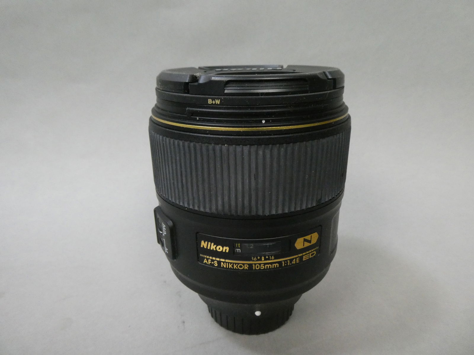 Nikon Nikkor AF-S 105mm f1.4 E ED Lens w/ HB-79 Hood: Nikon Nikkor AF-S 105mm f1.4 E ED Lens w/ HB-79 Hood This item is from a Gurnee, IL private estate. The estate included lots of cameras and accessories, motorcycles and parts, vehicles, knives, guns,