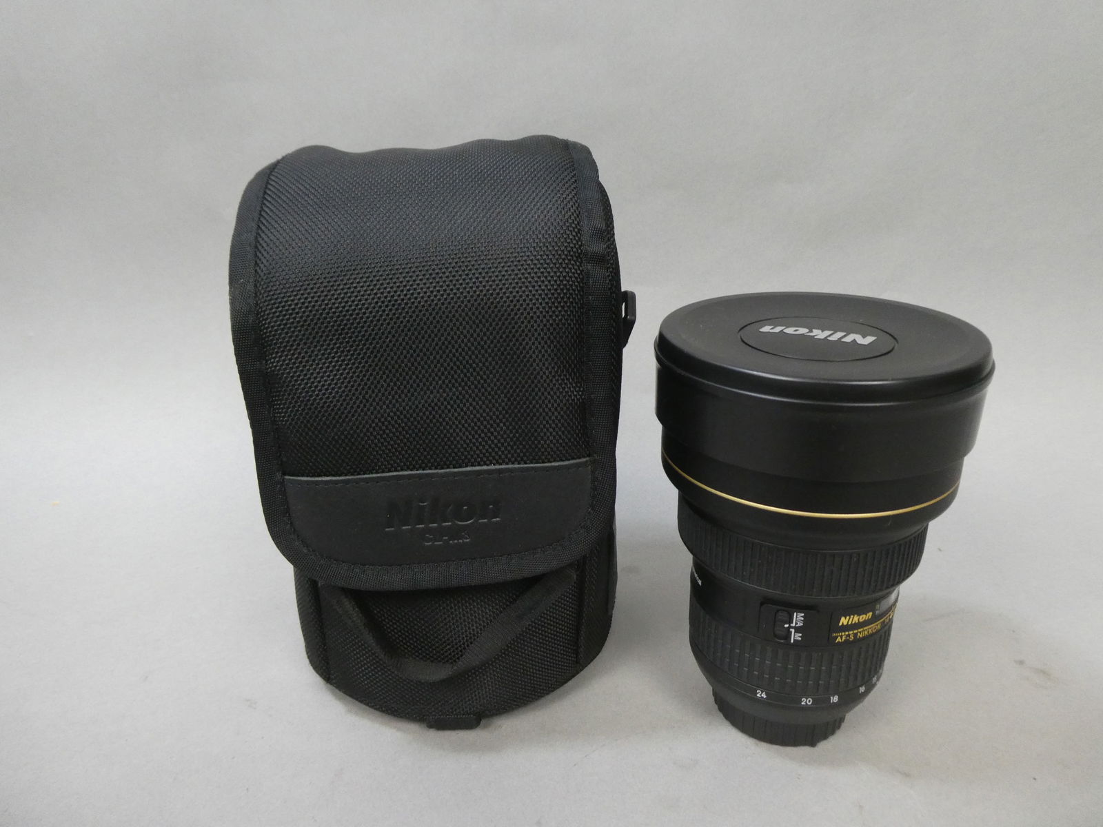 Nikon AF-S Nikkor 14-24mm 1:2.8 G Ed Lens w/ CL-M3 Case: Nikon AF-S Nikkor 14-24mm 1:2.8 G Ed Lens w/ CL-M3 Case This item is from a Gurnee, IL private estate. The estate included lots of cameras and accessories, motorcycles and parts, vehicles, knives, gun