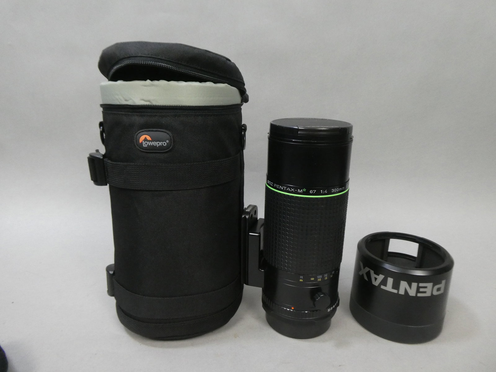 SMC Pentax M* ED IF 67 300mm f/4 Green Star MF Lens 6x7 67 II: SMC Pentax M* ED IF 67 300mm f/4 Green Star MF Lens 6x7 67 II with case, hood and Really Right Stuff attachment This item is from a Gurnee, IL private estate. The estate included lots of cameras and a