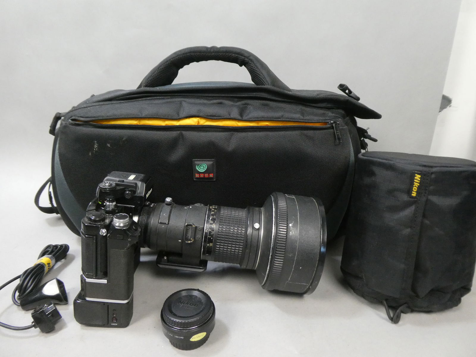 Nikon F2 AS 35mm SLR Film Camera W/ MD-2 Motor Drive MB-1 Battery Pack 300mm Lens: Nikon F2 AS 35mm SLR Film Camera W/ MD-2 Motor Drive MB-1 Battery Pack, NIKKOR ED 300mm 1:3.8 lens, Teleconverter TC-148 and a Bata Insert Trolley Carrying Bag This item is from a Gurnee, IL private e