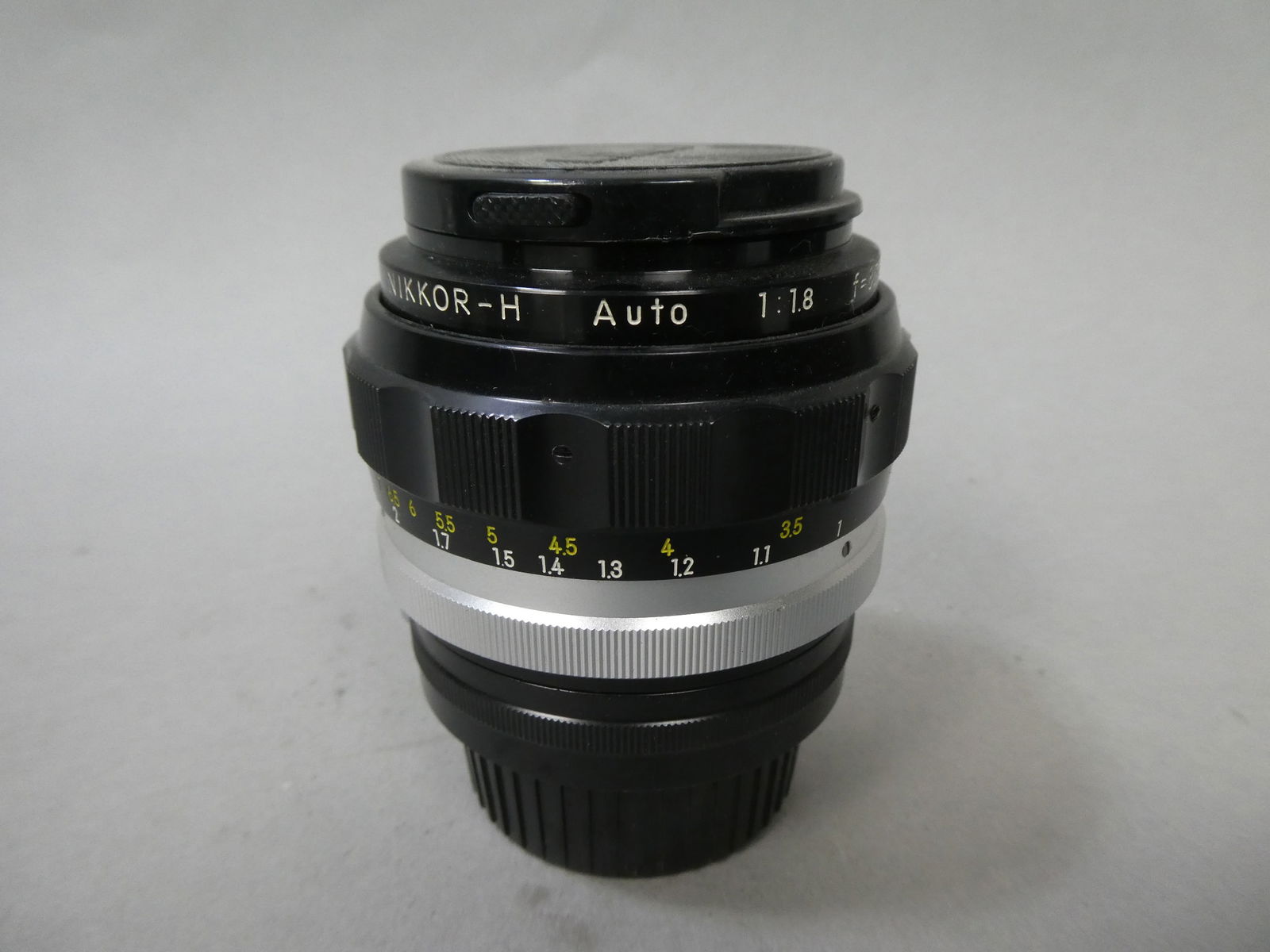 Nikon Nikkor-H Auto 1:1.8 85mm Lens: Nikon Nikkor-H Auto 1:1.8 85mm Lens This item is from a Gurnee, IL private estate. The estate included lots of cameras and accessories, motorcycles and parts, vehicles, knives, guns, tools, workshop e