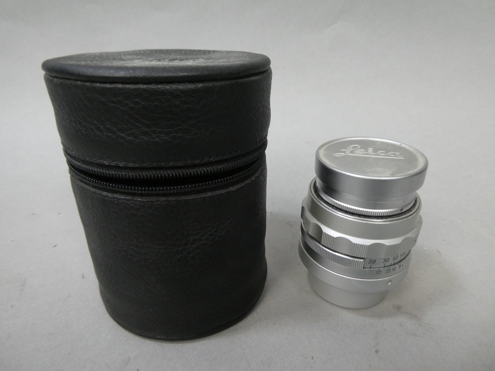 Leica Ernst Leitz GmbH Wetzlar Summicron f 9cm 90mm 1:4 Lens in Case: Leica Ernst Leitz GmbH Wetzlar Summicron f 9cm 90mm 1:4 Lens in Case This item is from a Gurnee, IL private estate. The estate included lots of cameras and accessories, motorcycles and parts, vehicles