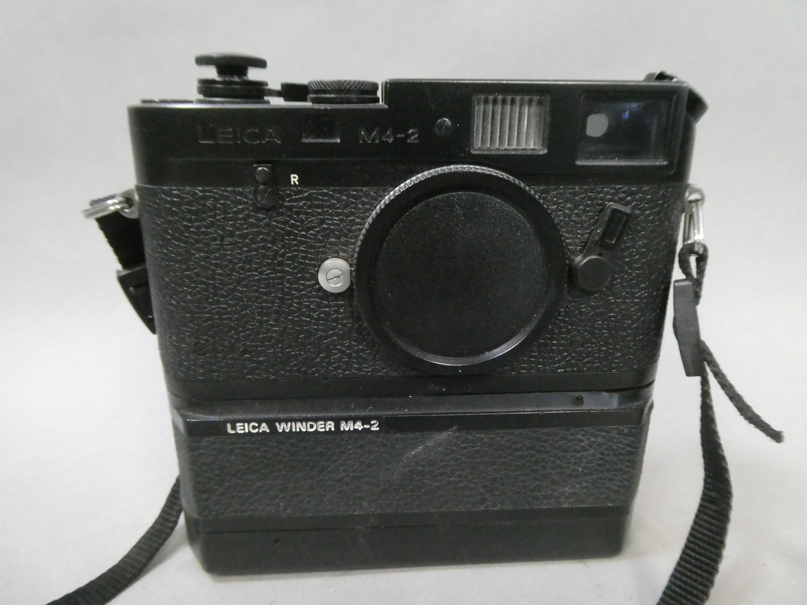 Leica M4-1 Rangefinder Film Camera Body w/ Winder: Leica M4-1 Rangefinder Film Camera Body w/ Winder This item is from a Gurnee, IL private estate. The estate included lots of cameras and accessories, motorcycles and parts, vehicles, knives, guns, too