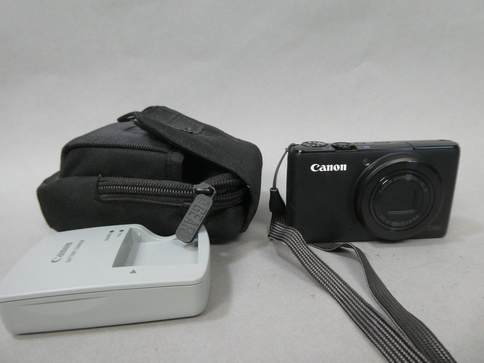 Canon PowerShot S95 10mp Compact Digital Camera w/ Charger & Bag: Canon PowerShot S95 10mp Compact Digital Camera w/ Charger & Bag This item is from a Gurnee, IL private estate. The estate included lots of cameras and accessories, motorcycles and parts, vehicles, kn