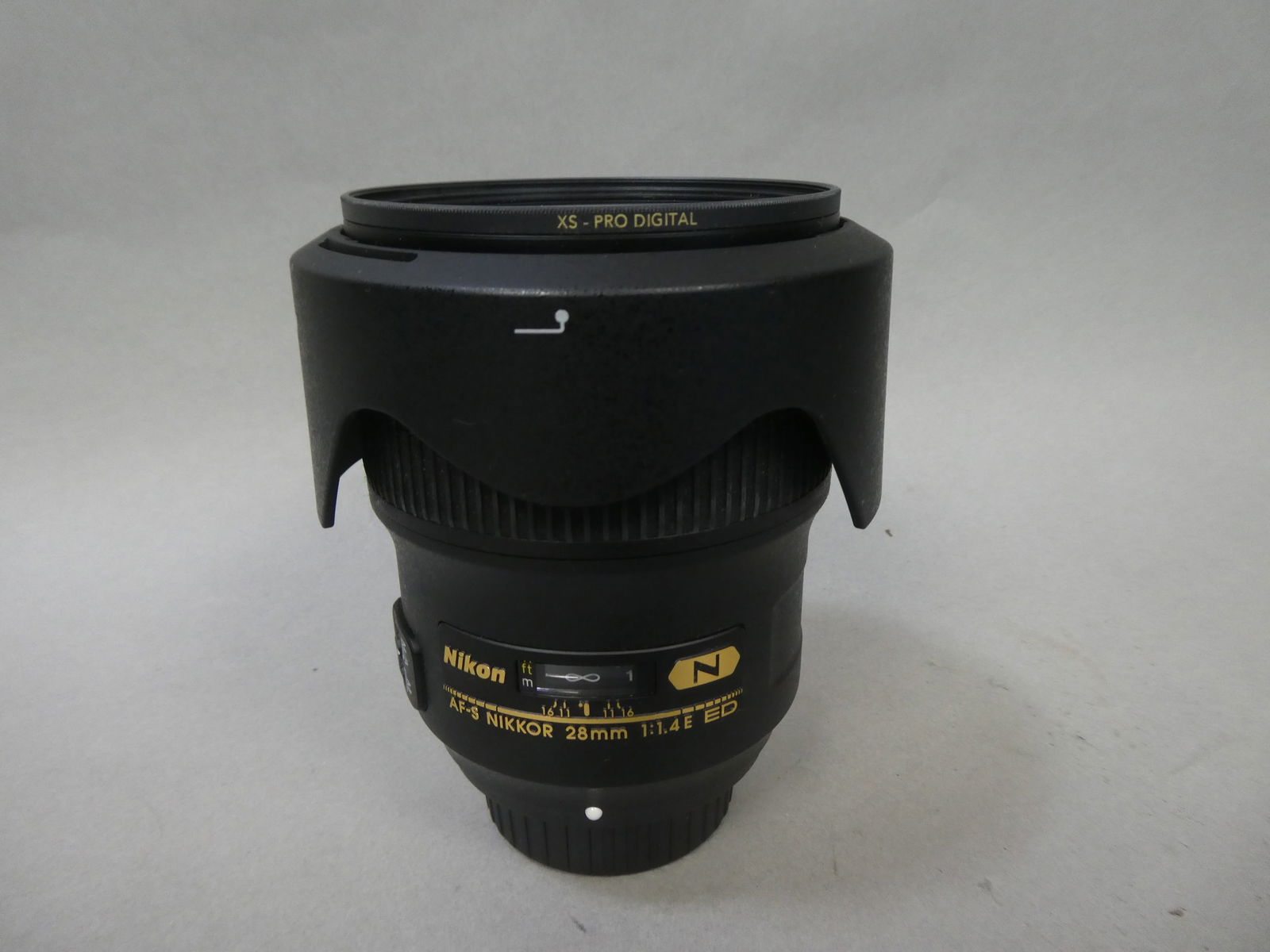 Nikon NIKKOR AF-S 28mm 1:1.4 ED Lens w/ HB-83 Hood & B&W Filter: Nikon NIKKOR AF-S 28mm 1:1.4 ED Lens w/ HB-83 Hood & B&W Filter This item is from a Gurnee, IL private estate. The estate included lots of cameras and accessories, motorcycles and parts, vehicles, kni