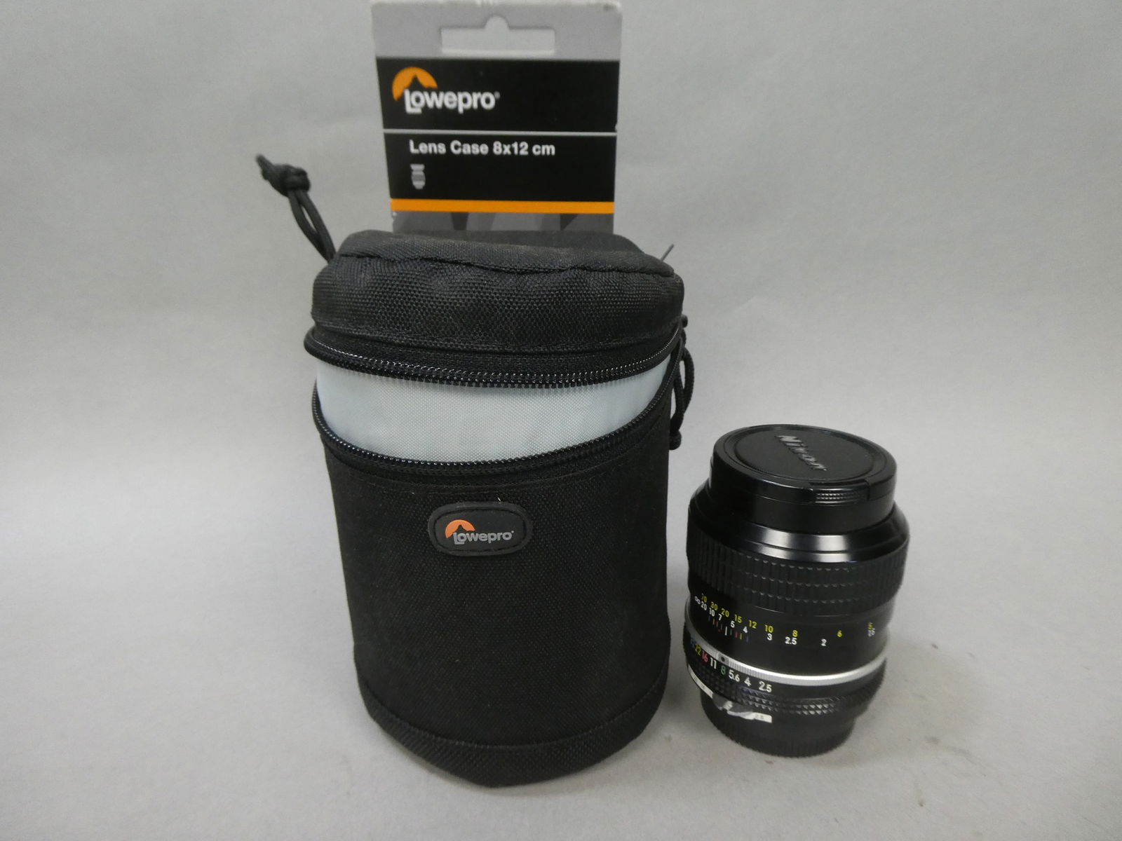 Nikon NIKKOR 105mm 1:2.5 678517 Lens w/ Lowepro case: Nikon NIKKOR 105mm 1:2.5 678517 Lens w/ Lowepro case This item is from a Gurnee, IL private estate. The estate included lots of cameras and accessories, motorcycles and parts, vehicles, knives, guns,