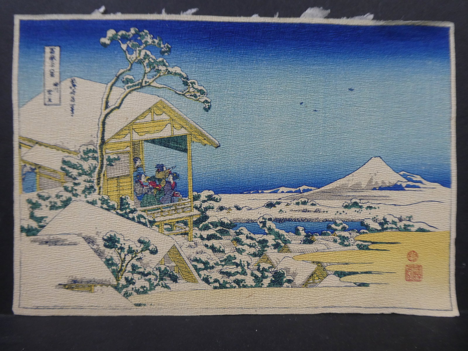 Repro Katsushika Hokusai Snow at Koishikawa Japanese Woodblock Print: Repro Katsushika Hokusai Morning After the Snow at Koishikawa Edo from Thirty Six Views of Fuji Japanese Woodblock Print on creped paper, not framed. Measurements in inches: 8 1/4 x 5 3/4 Condition:Li