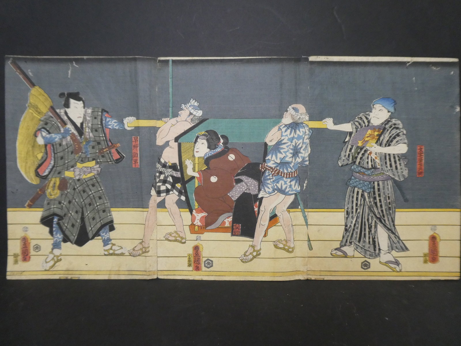 Original 19th Century Toyokuni III Japanese Woodblock Print Carrying Woman Triptych: Original 19th Century Toyokuni III Japanese Woodblock Print Carrying Woman Triptych. Unframed.. Measurements in inches: 29 x 14 1/2 Condition:Hassoiling and worming Shipping:We offer in-house shipping