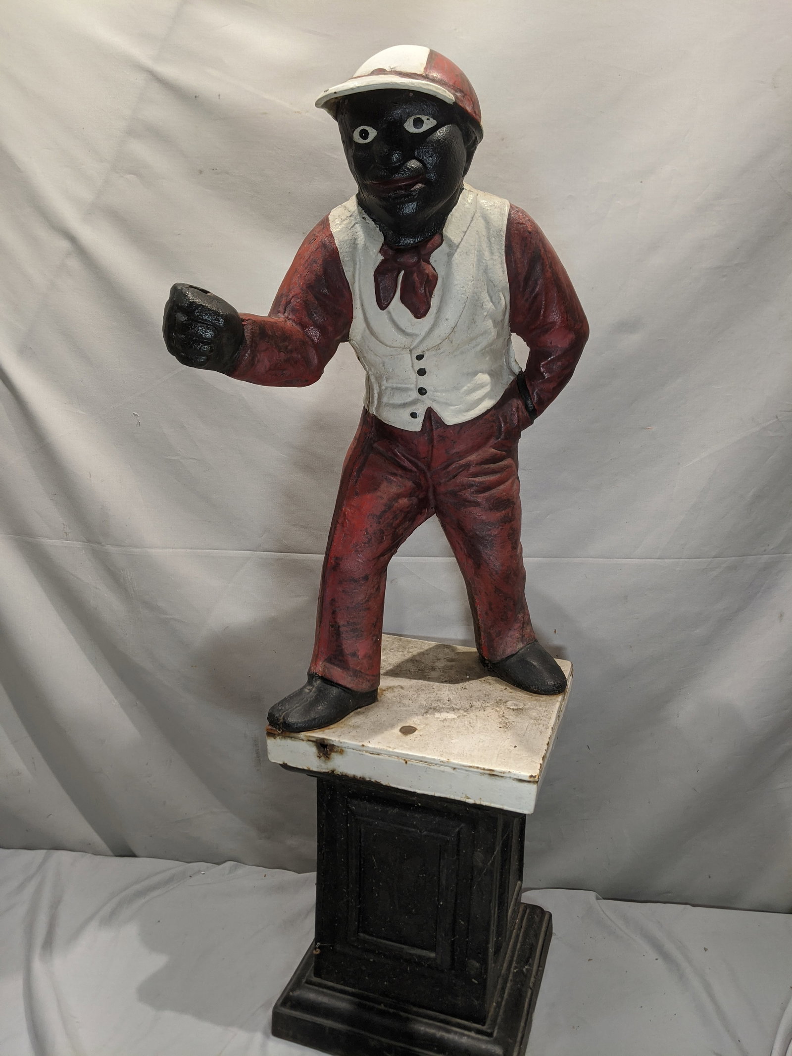 Vintage Cast Iron Black Jocko Lawn Ornament Stature: Vintage Cast Iron Black Jocko Lawn Ornament Stature. Measurements in inches: 37 high x 19 square base. 61 lbs Condition:Shows some wear and surface rust and missing ring Shipping:We offer in-house shi