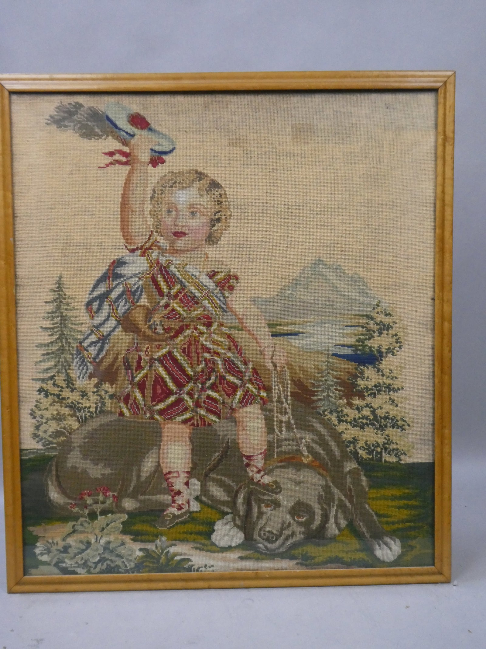 1930's Criss Stitch Embroidery of Scottish Girl & Her Dog: 1930's Criss Stitch Embroidery of Scottish Girl & Her Dog framed under glass. Measurements in inches: 29 x 25, image: 27 x 23 Condition:Fabric has some mild yellowing Shipping:We offer in-house shippi