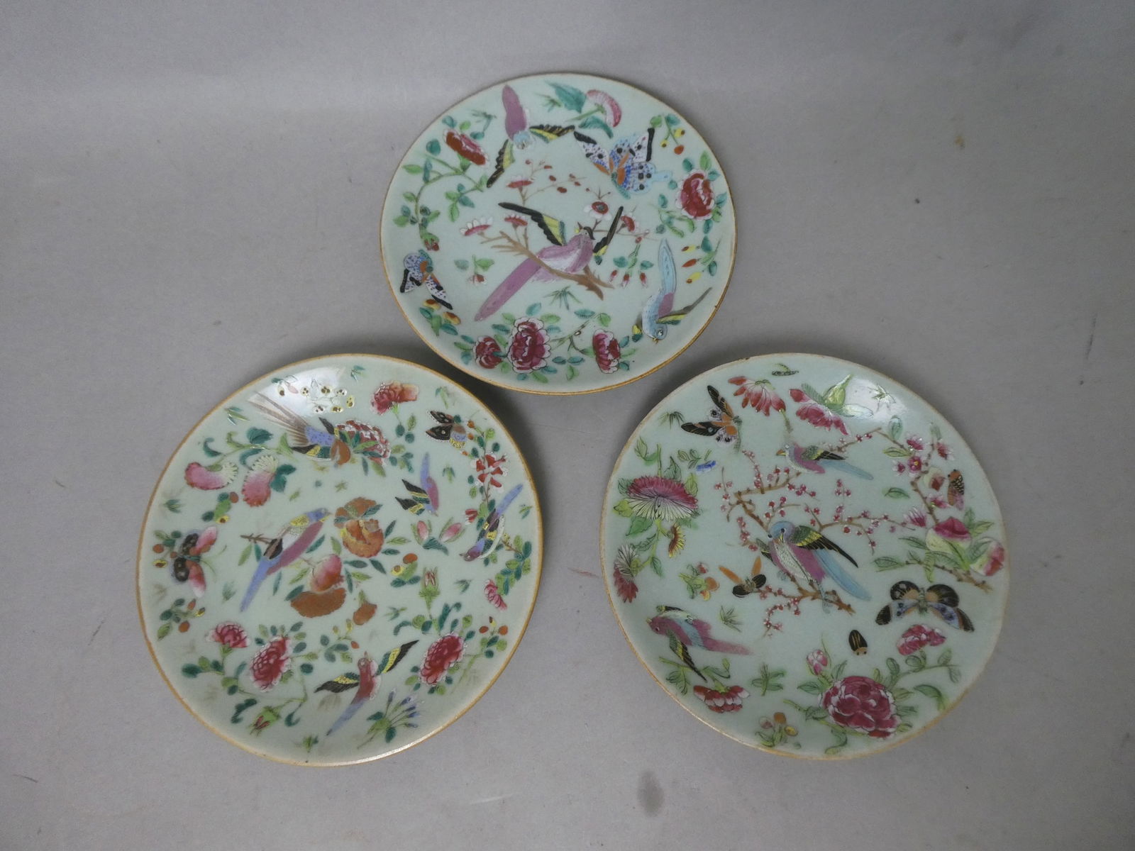 Late 19th Century Chinese 3 Bean Green Famille Rose Plates: celadon ground with butterflies, birds and flowers with blue shop seal. Measurements in inches: 7.75" D x 1" H Condition:Good with no chips, cracks or repairs Shipping:We offer in-house shipping. Item