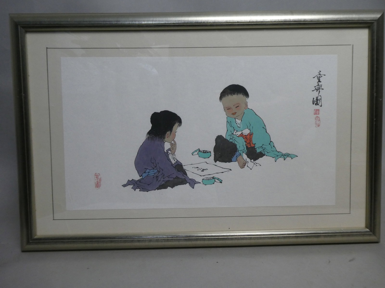 Zeng Fan Children Playing Go Colored Drawing: Zeng Fan Children Playing Go Colored Drawing on paper. Framed under glass. Listed Chinese artist born 1938. Have companion piece in matching frame also up for auction. Measurements in inches: 23 x 15,