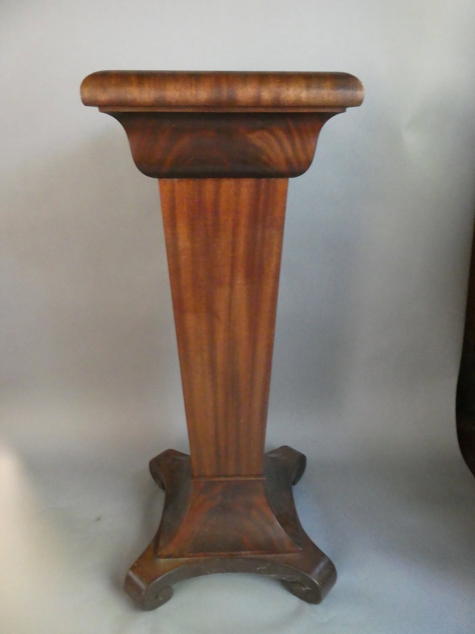 Antique Empire Flame Mahogany Floor Standing Pedestal: Antique Empire Flame Mahogany Floor Standing Pedestal. Measurements in inches: 38 high x 14 x 14 Condition:Normal wear with age and use Shipping:We offer in-house shipping. Item(s) will be packed afte