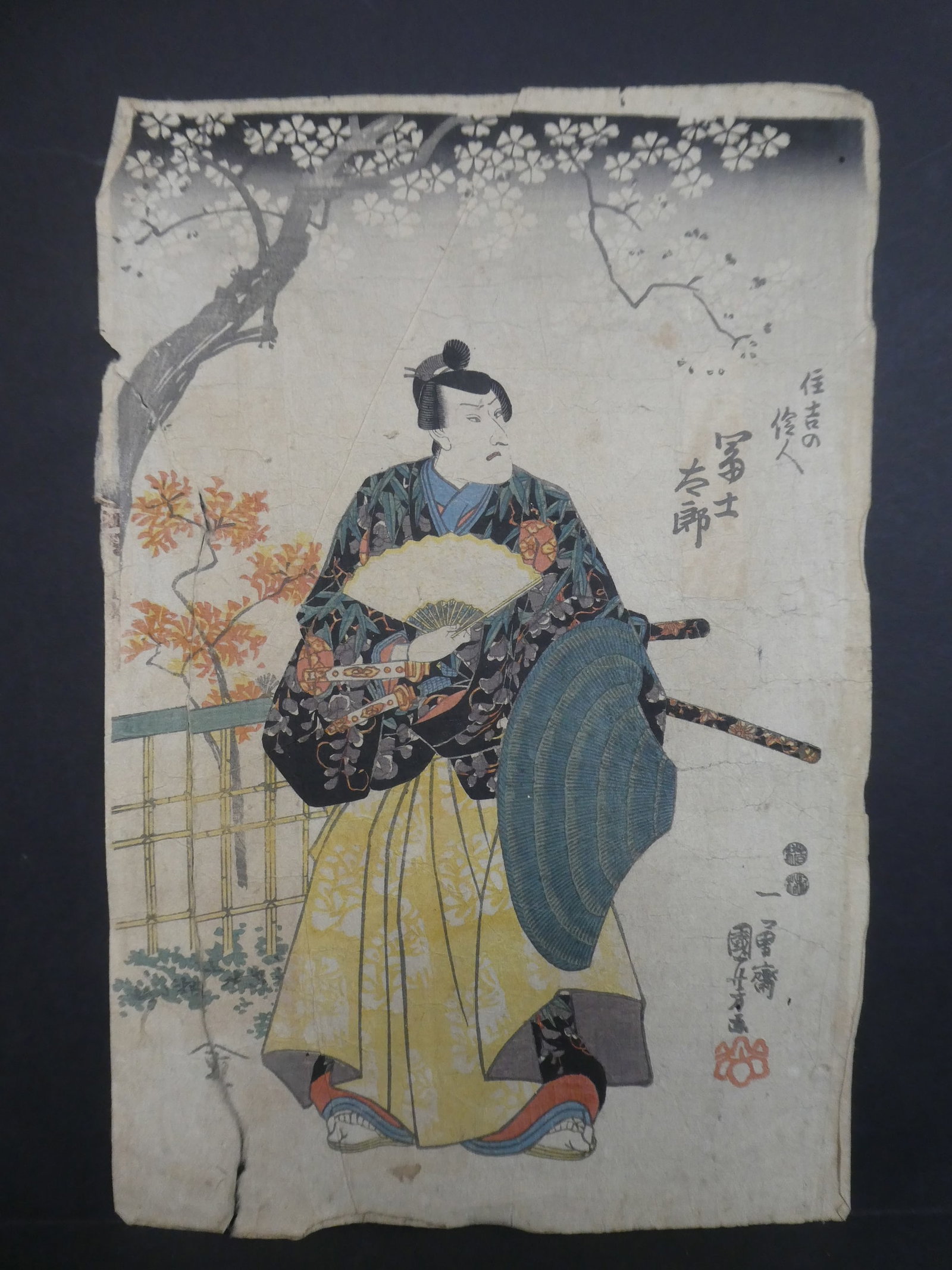 Original 19th Century Utagawa Kuniyoshi Japanese Woodblock Print Man w/ Fan: Original 19th Century Utagawa Kuniyoshi Japanese Woodblock Print Man w/ Fan. Unframed.. 10 x 15. Has wrinkles toning, fading and long taped tear on left ide Shipping:We offer in-house shipping. Item(s