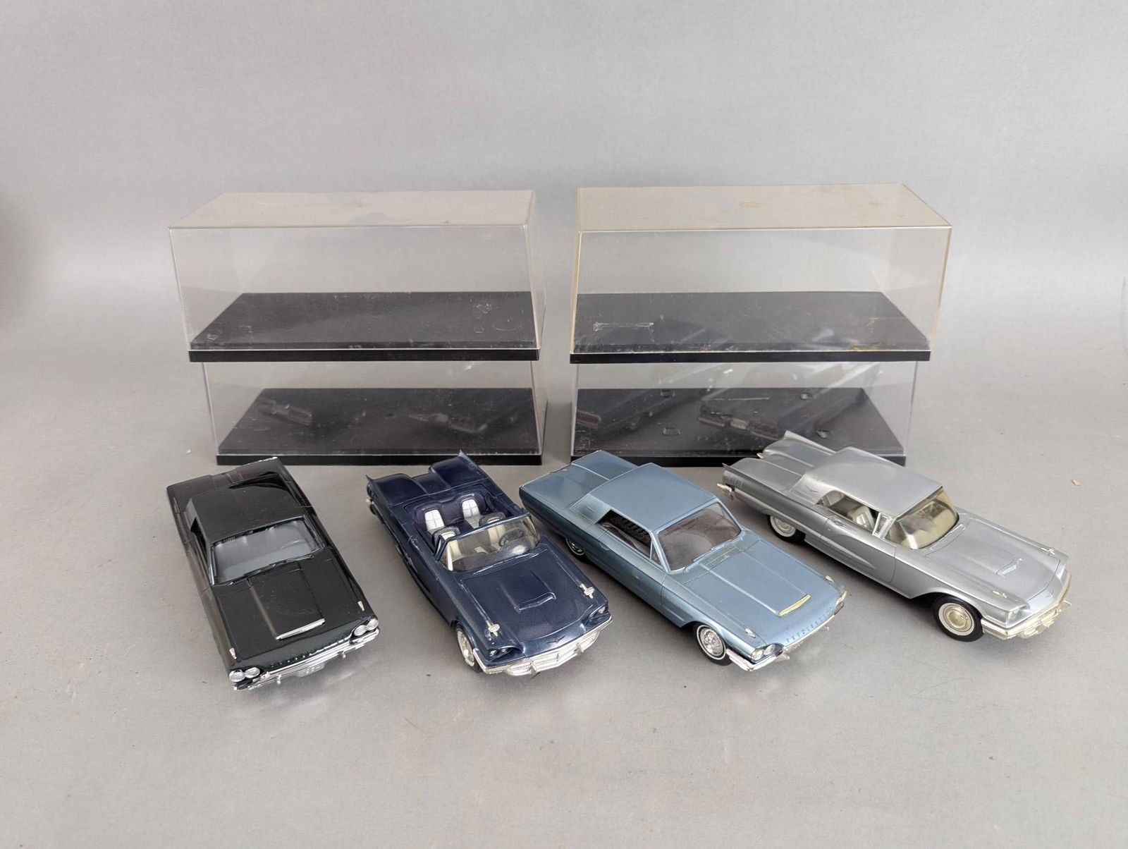 Set of Four 1/24 Scale Promo Ford Thunderbird Models: Set of four 1/24 scale promotional Ford Thunderbird models including two made of plastic, one metal, and one a Philco radio, which has not been tested. The set includes various color finishes and deta