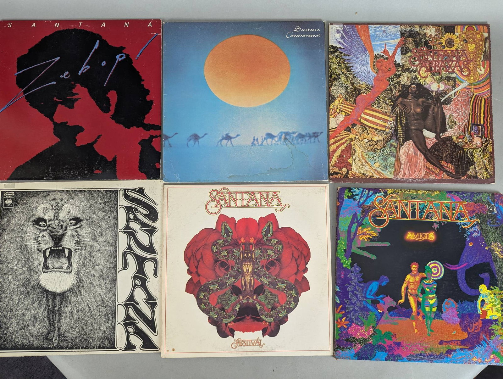 Lot of Eight Record Albums Featuring Santana and Solo Artists: This lot includes eight record albums featuring Santana and related artists. Titles in this lot are as follows: Zebop by Santana, Caravanserai by Santana, Abraxas by Santana, Santana Self-Titled, Lotu