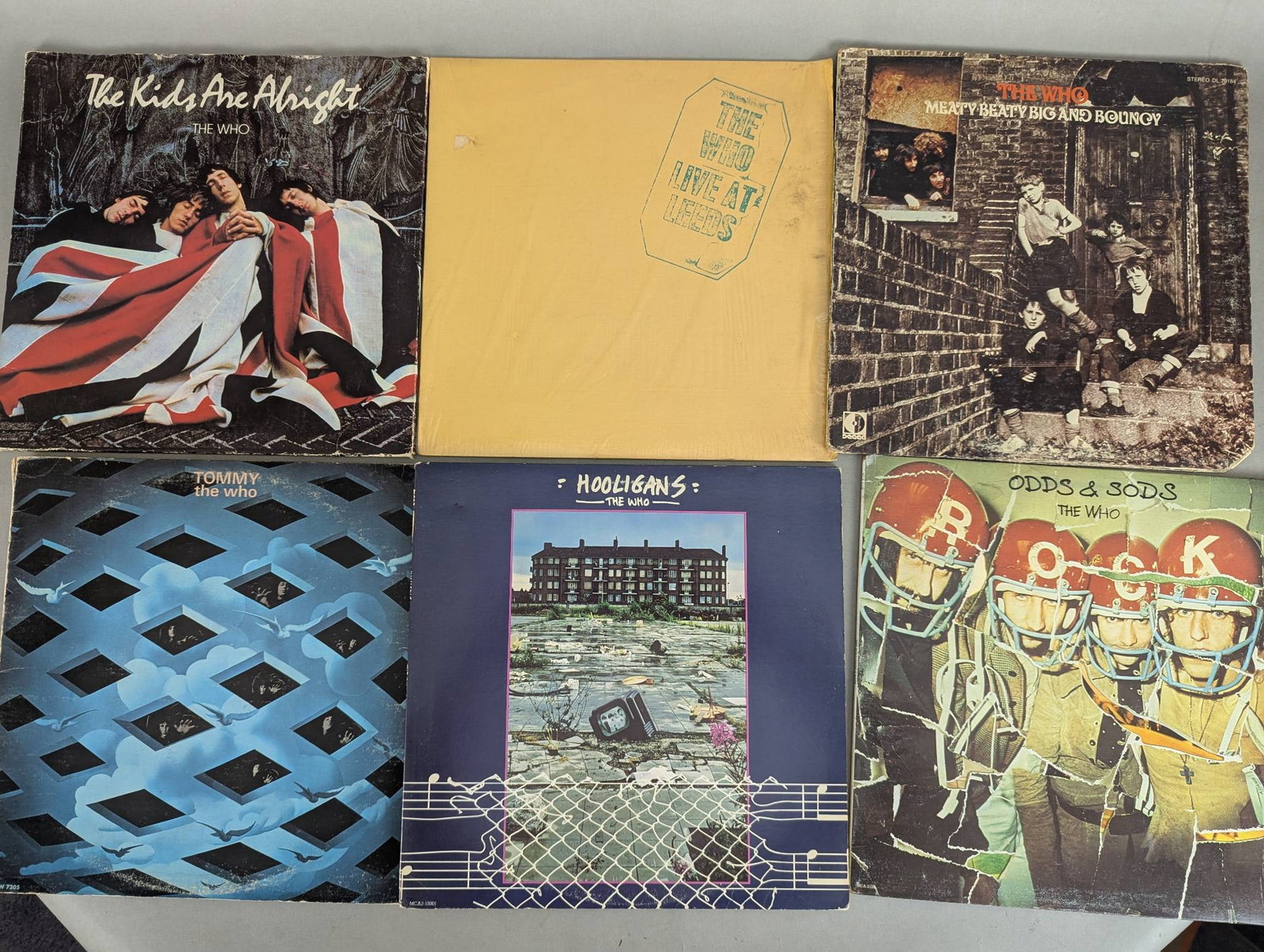 Lot of Eight Music Records By The Who: This is a lot of eight record albums, primarily featuring The Who. Titles include The Kids Are Alright, Meaty Beaty Big and Bouncy, Tommy, The Who Hooligans, Odds and Sods, Live at Leeds, Who Are You,