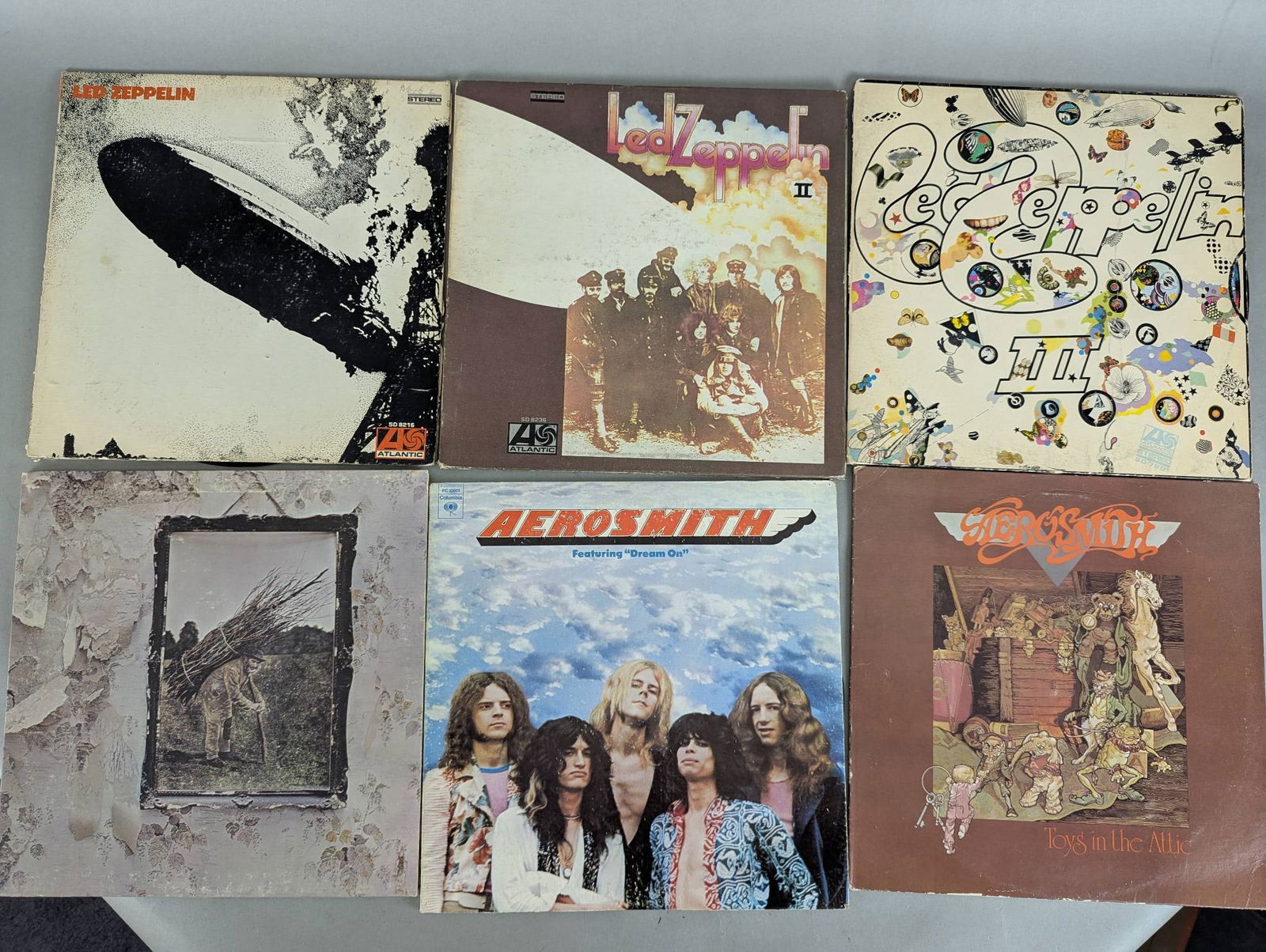 Collection of Vinyl Records Featuring Led Zeppelin, Aerosmith, and Heart (1 of 2)