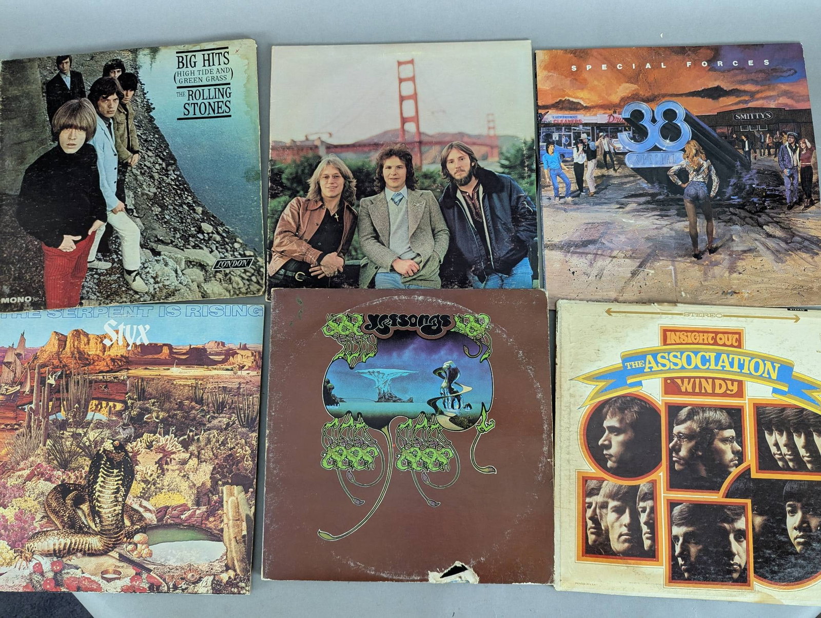 Collection of 30 Record Albums Featuring Various Artists and Bands: This lot features a collection of 30 vinyl record albums from various artists and bands. Titles included in this collection are: Big Hits High Tide and Green Grass by The Rolling Stones, 33 by America