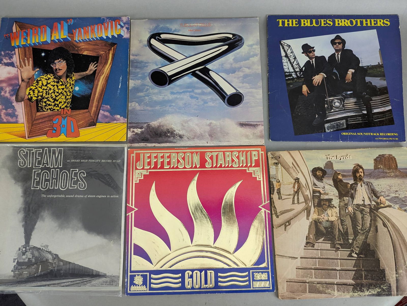 Collection of Vinyl Records Featuring Various Bands and Albums (1 of 5)