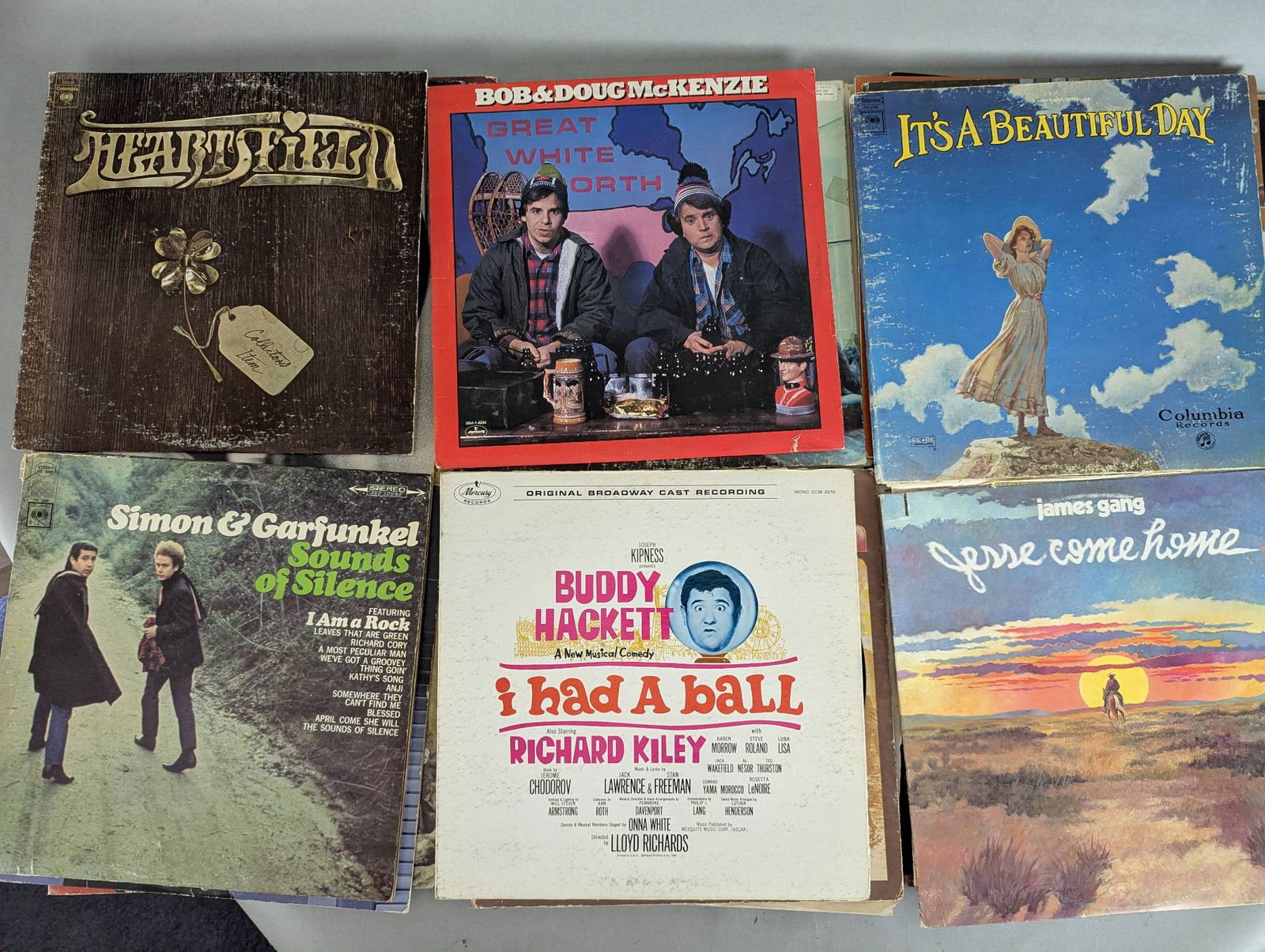 Lot of Record Albums Including Simon and Garfunkel Led Zeppelin and Stevie Wonder: This lot includes a collection of record albums featuring various artists and genres. Titles include Simon and Garfunkel Sounds of Silence, Led Zeppelin II, Stevie Wonder For Once In My Life, The Fire