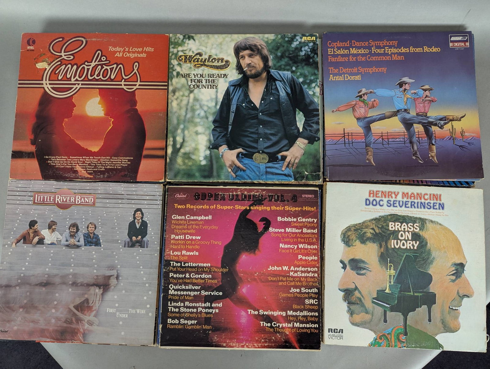 Lot of 48 Record Albums Including Musical Scores and Compilation LPs: This lot features 48 record albums encompassing a wide variety of genres, artists, and themes, ideal for both collectors and enthusiasts. Included are notable titles such as 'Bright Side of Music', 'M