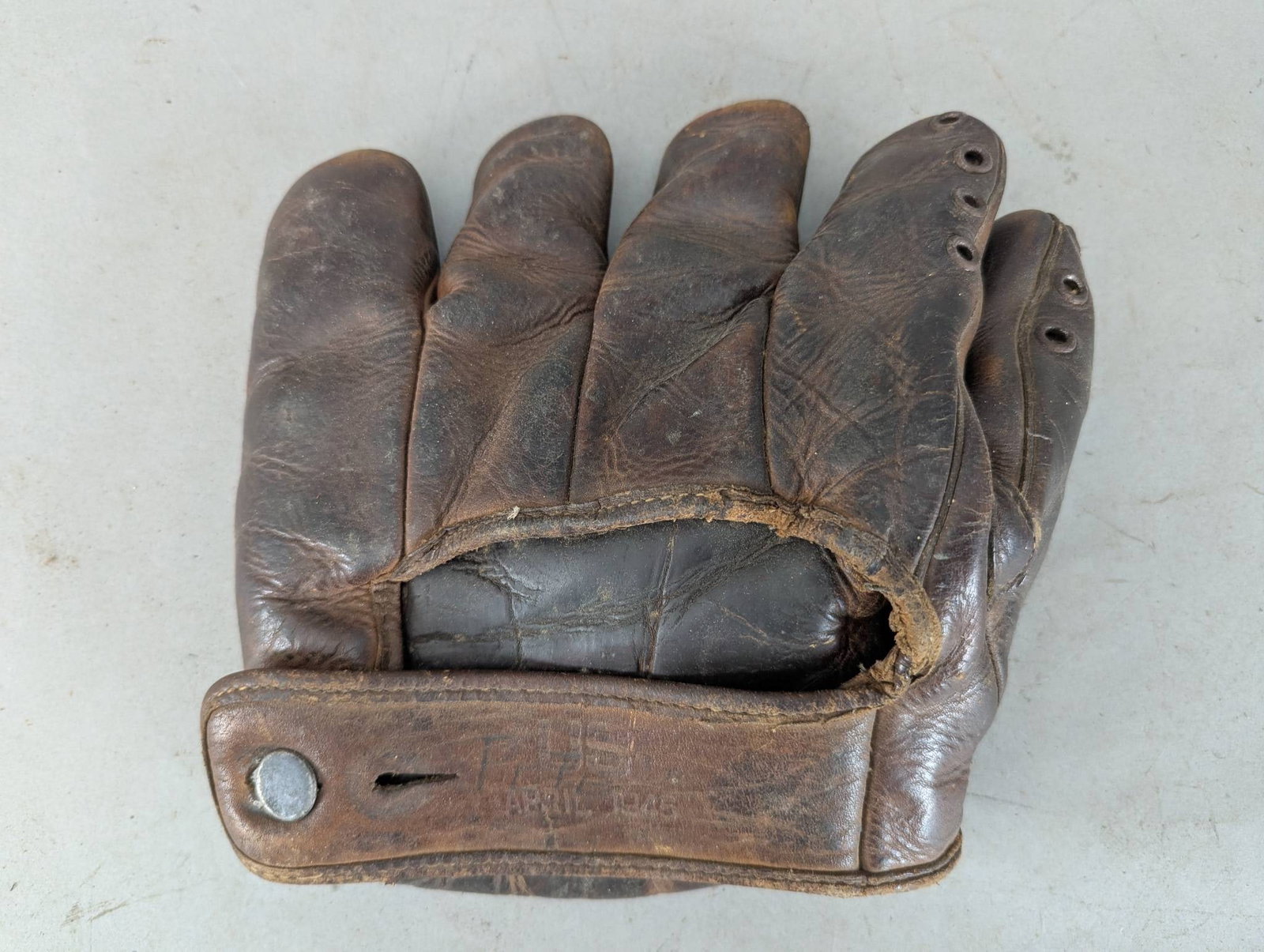Vintage Nokona Baseball Glove US April 1945: A vintage Nokona baseball glove marked US April 1945, showcasing its historical value. Crafted from durable leather and designed for a right-handed player, this glove features a classic design known f
