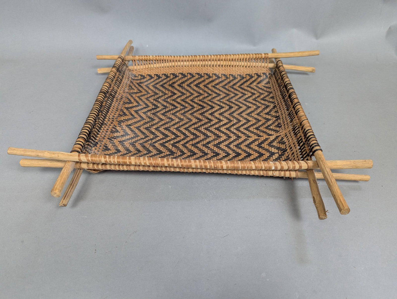 South African Split Reed and Wood Square Sifting Sieve: South African square sifter or sieve crafted from split reed and wood with an intricate woven design. The item measures approximately 19 inches square and features an interwoven zigzag pattern with op
