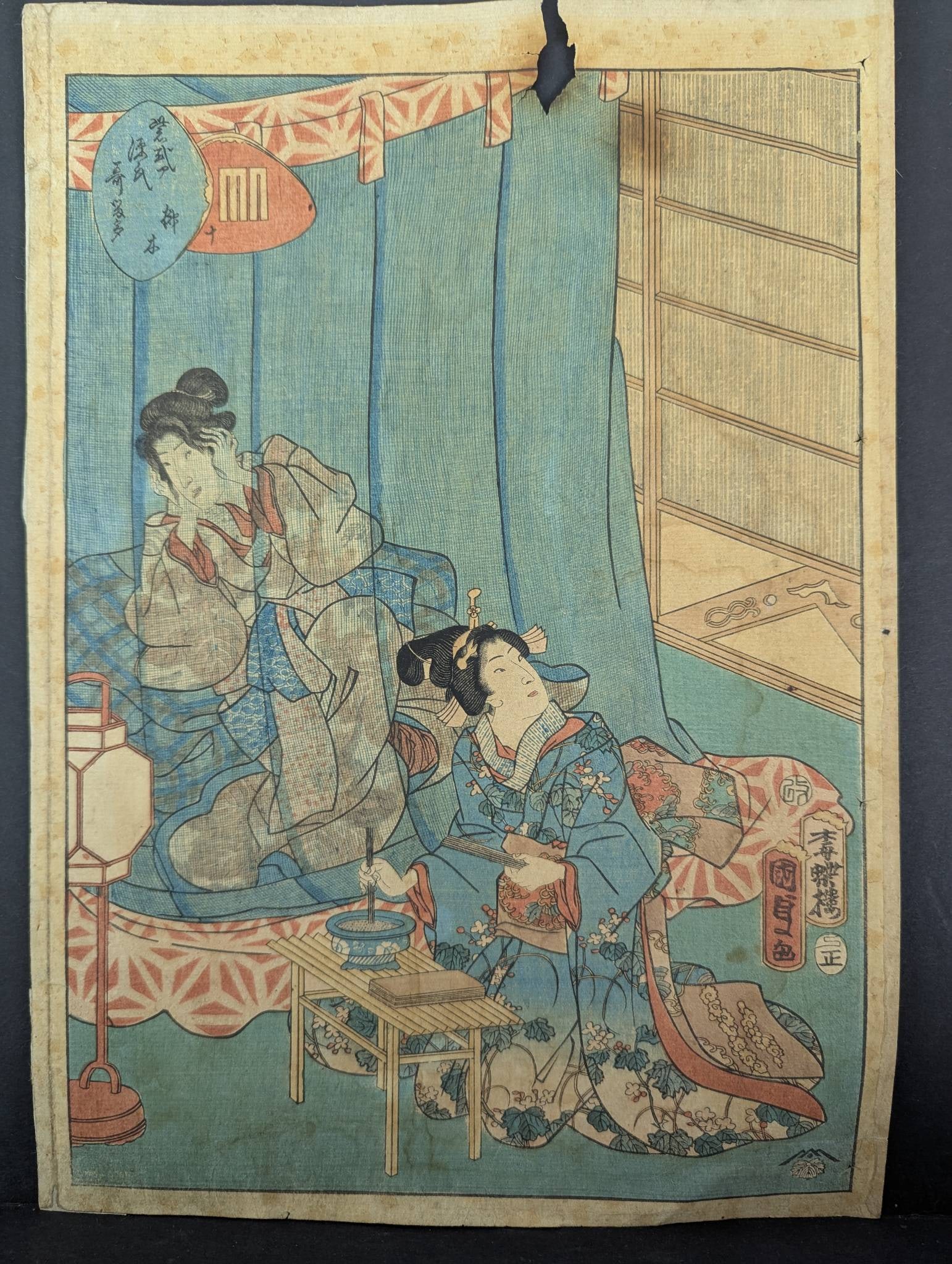 Japanese Woodblock Print Tales of the Genji by Kunisada II: Kunisada II Japanese woodblock print illustrating a scene from Tales of the Genji. The artwork features detailed depictions of figures in traditional attire set within an interior scene with furnishin