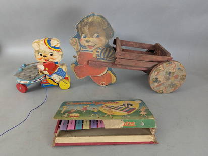 Lot of Vintage Toys Including Cragstan Xylophone and Fisher Price Ziggy Zilo: Lot of vintage toys featuring a Cragstan xylophone in its original box with pastel-colored metal keys and illustrated box lid, a Fisher Price Ziggy Zilo wooden pull toy featuring a dog design with xyl