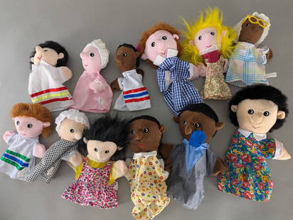 Set of 12 2001Â PlushPups Hand Puppets Plush Dolls: A collection of 12 hand puppets made by PlushPups in 2001. These puppets are constructed from fabric and plush material and feature a variety of colorful outfits and diverse character designs. Each