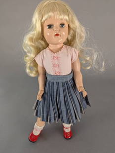 16 Inch Ideal Toni Doll P91 with Blonde Hair and Original Outfit: Ideal Toni doll P-91 featuring a 16 high x 7 wide x 3 deep with blonde hair and blue eyes. Marked 'Ideal Doll P-91 Made in U.S.A.' on the back of the head. She is dressed in a pink top with lace