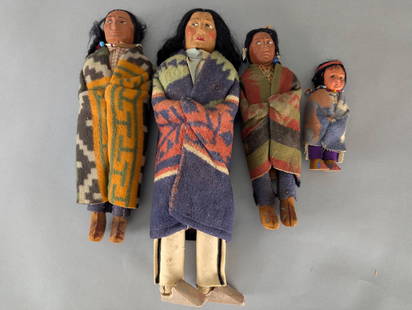 Set of Four Skookum Native American DollsÂ : Set of four Skookum dolls, crafted with detailed features and dressed in Native American style attire. The dolls measure 6, 12, 13, and 16 high x 4 wide x 3 deep respectively. Each doll is adorned