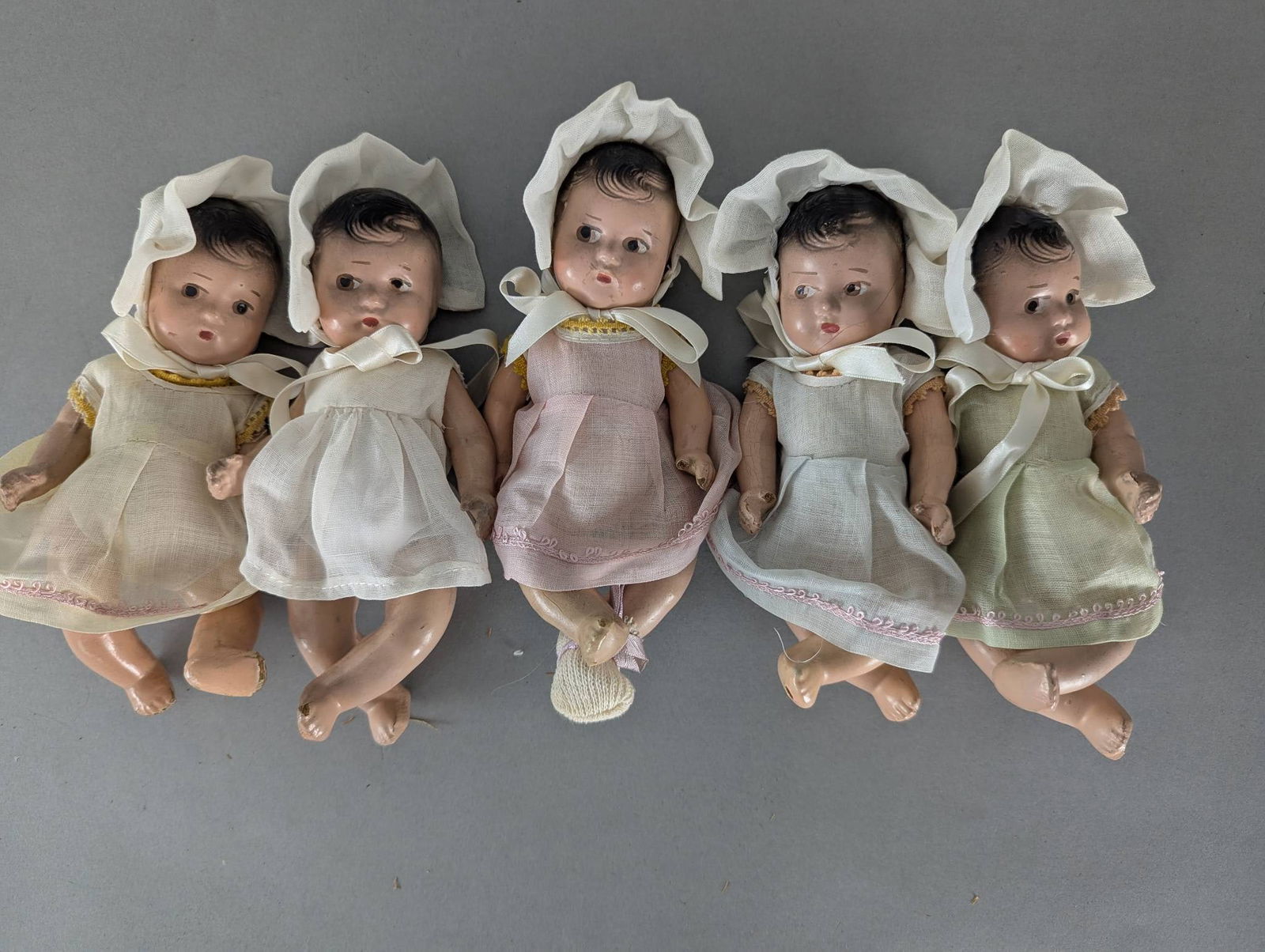 Lot of Five Composition Baby Dolls with Bonnets and Dresses (1 of 7)