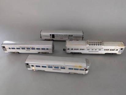 AMT American Model Toys and Lionel Santa Fe Passenger Cars Set: Set of Santa Fe passenger train cars manufactured by American Model Toys and Lionel Corporation. Includes four aluminum passenger cars, each marked with 'Santa Fe' and specific car names. Cars show we