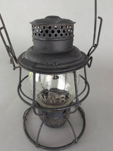C&NW Railroad Lantern with Clear Embossed Globe Chicago & Northwestern: C and NW Railroad lantern manufactured by The Adams and Westlake Company. The piece features a clear embossed glass globe marked C and NW R, indicative of its association with the Chicago and North