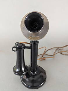 Early Twentieth Century Candlestick Telephone: Early twentieth-century candlestick telephone, featuring a black painted metal body with a detachable receiver and integrated wiring. The microphone and earpiece maintain their original design