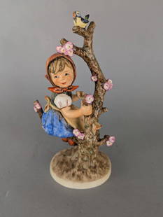 Goebel Hummel Figurine Apple Tree Girl 141 V 11 High: Goebel Hummel figurine titled Apple Tree Girl, identified by model number 141 V, standing 11 inches high. This finely crafted ceramic piece shows a young girl climbing a flower-covered tree with a