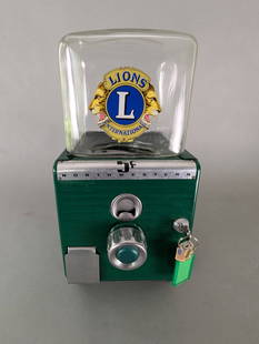 Northwestern Model 33 Green Gumball Machine: Northwestern Model 33 gumball machine featuring a durable green painted metal body and clear glass hopper. The machine showcases an emblem for the Lions Club International on the front hopper and reta