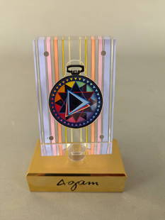 Yaacov Agam Lovestar Movado Pocket Watch in Lucite Stand: Yaacov Agam Lovestar limited edition Movado pocket watch presented in a lucite stand. The piece is designed with vibrant geometric patterning and vertical colorful lines, characteristic of Agam's arti