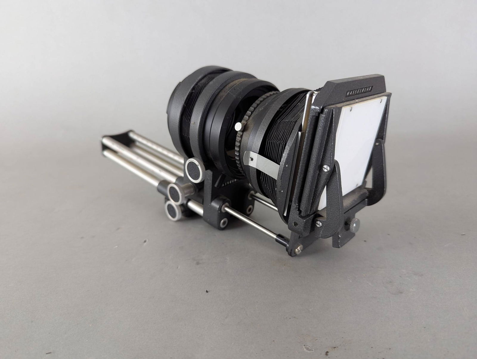 Hasselblad Bellows Attachment with Adjustable Rails: Hasselblad bellows attachment featuring a bellows unit constructed with durable materials for photographic use. Equipped with adjustable metal rails measuring 13 high x 4 1/2 deep x 6 wide as indicate