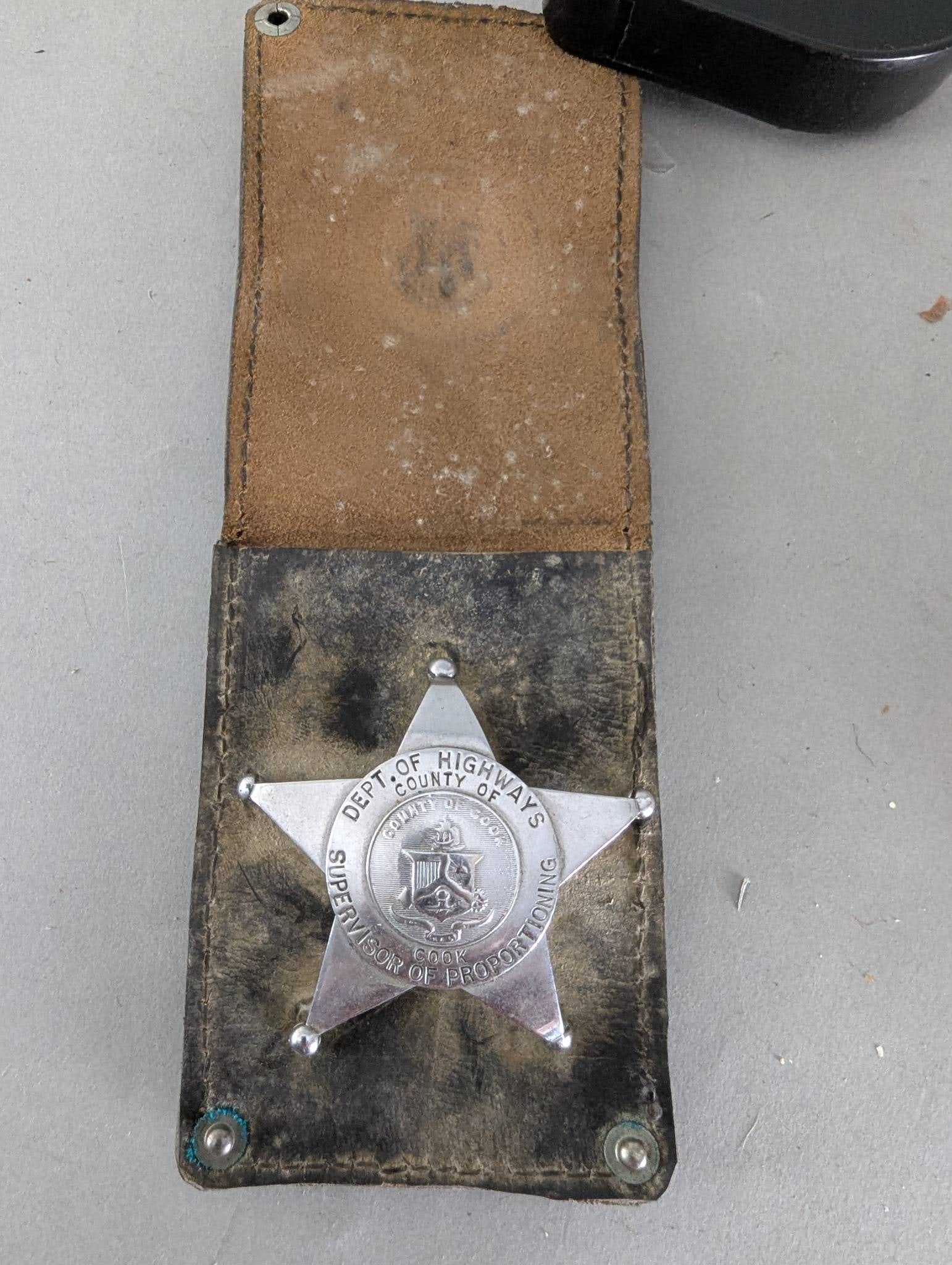 Cook County Illinois Department of Highways Badge with Case: Cook County Illinois Department of Highways badge engraved with Supervisor of Production along its center, along with the Cook County seal. The badge features a five-pointed star design and is display