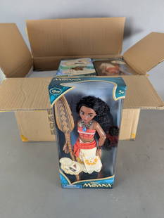 15 Disney Moana Dolls in Original Packaging: 15 Disney Moana dolls, each in its original retail packaging. Dolls feature Moana from the Disney animated film and include detailed accessories such as her signature oar. The packaging indicates that