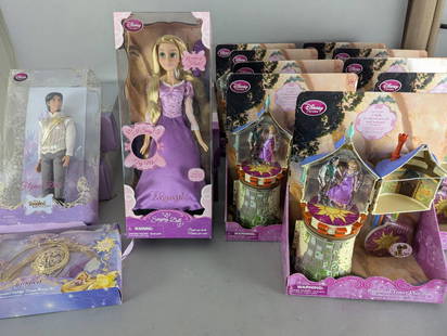 Disney Tangled Lot with Dolls, Play Sets, and Beauty Set: Disney Tangled merchandise comprising nine Rapunzel Tower Play Sets, three Flynn Rider dolls, three Rapunzel singing dolls, and one Tangled Golden Tresses Beauty Set. The Rapunzel Tower Play Set inclu