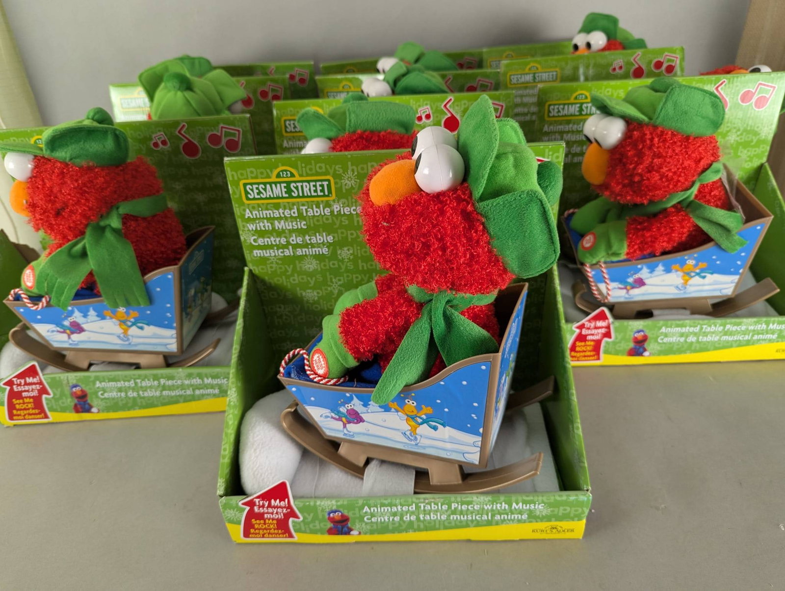 10 Sesame Street Elmo Animated Holiday Table Pieces with Music New: 10 Sesame Street Elmo Animated Table Pieces with Music. Each animated item features Elmo in holiday attire sitting on a sleigh. When activated, Elmo sings and rocks for a festive display. The packagin