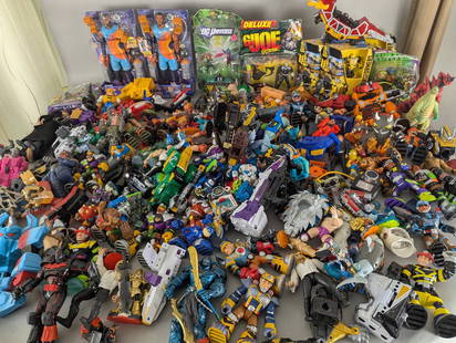 Huge Lot of Assorted Action Figures and Toys Including Transformers and Space Jam: Huge lot of assorted action figures and toys featuring multiple brands and series. Includes characters from Transformers, Space Jam, and Dig Universe, along with robots, dinosaurs, and a variety of ot