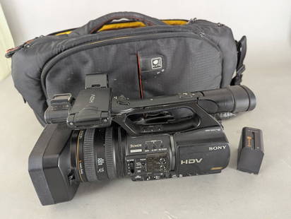 Sony HVR-Z5U Digital HD Video Camera Recorder with Accessories: Sony HVR-Z5U Digital HD Video Camera Recorder in used condition. The lot includes the camera, a carrying case measuring 21 high x 11 deep x 10 wide, and two Sony NP-F970 InfoLithium L-series batteries