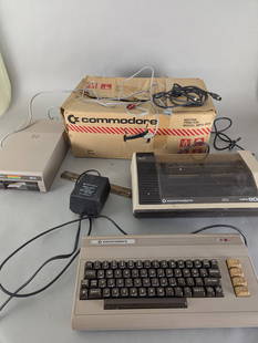 Commodore 64 System with Power Supply VIC-1541 MP 801 and Manuals: Commodore 64 system including a C64 computer, original power supply, VIC-1541 floppy disk drive, and MP-801 matrix printer. Accessories include cables, a box marked Commodore, and two manuals: Program